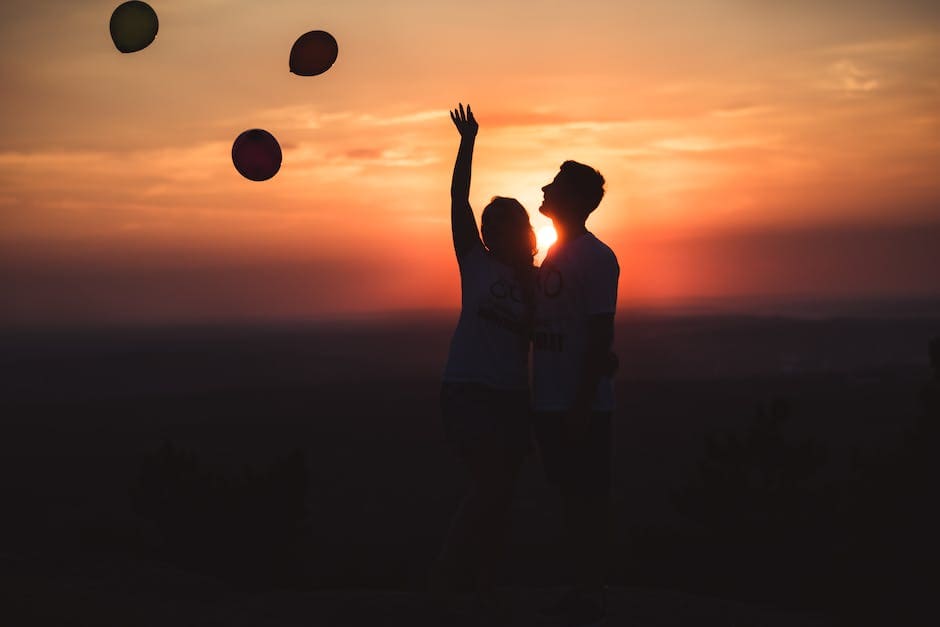 Silhouette Photo of Couple Standing Outdoors
